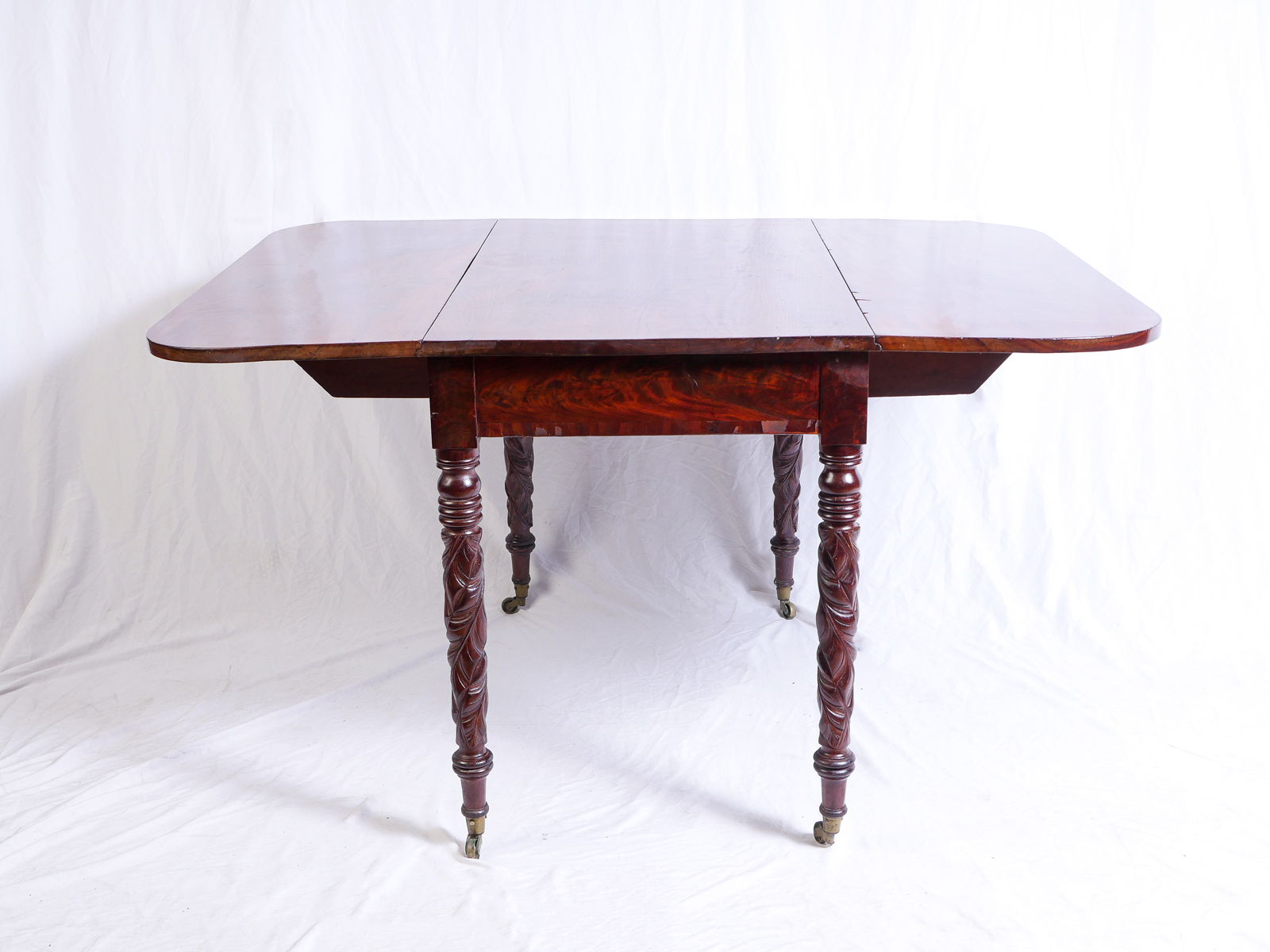 Appraisal: CARVED MAHOGANY DROP LEAF TABLE Carved victorian drop leaf table