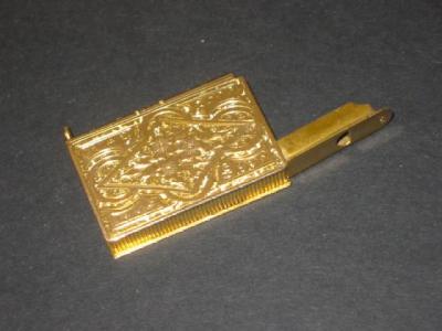 Appraisal: A CT GOLD NOVELTY VESTA CASE modelled as a book