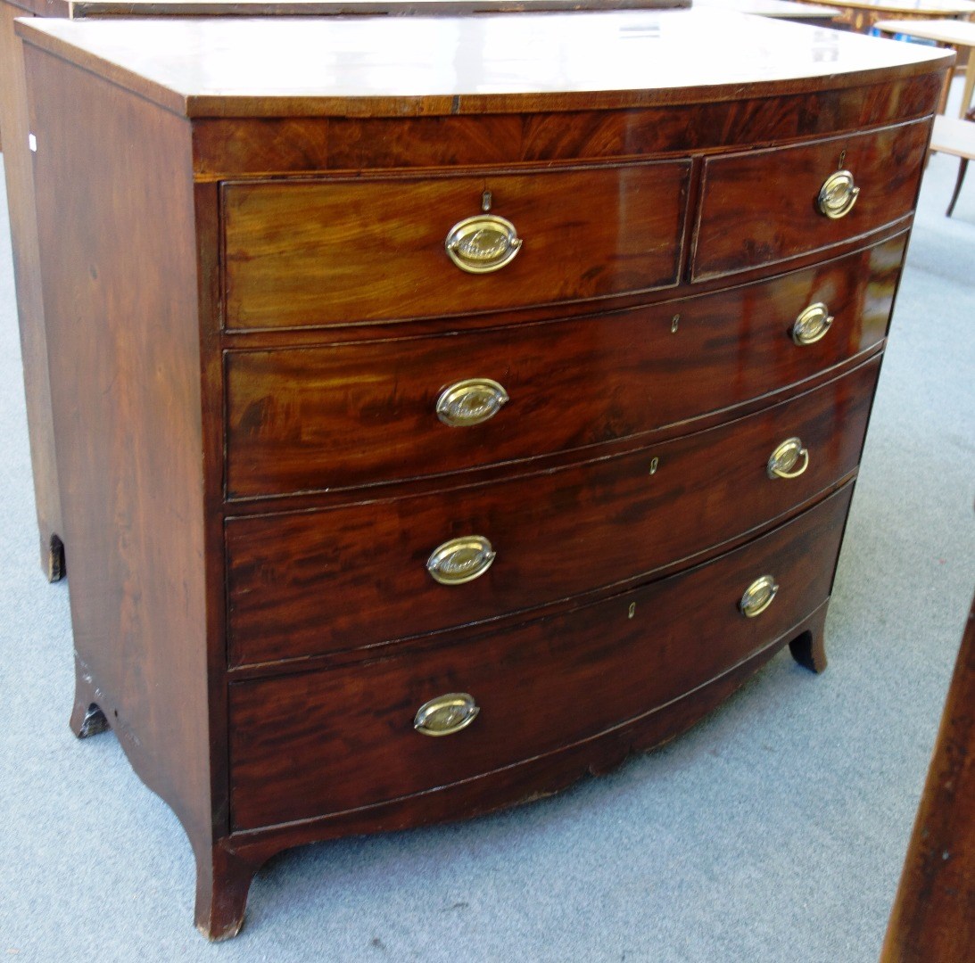 Appraisal: A th century inlaid mahogany bowfront chest of two short