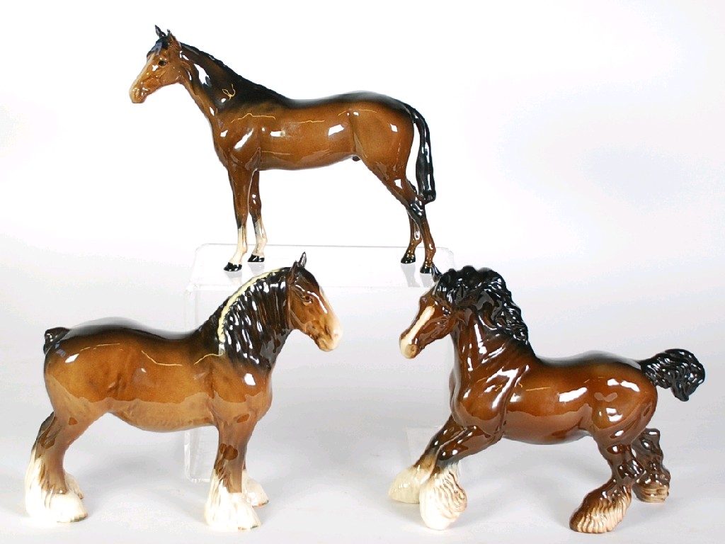 Appraisal: THREE BESWICK BROWN GLAZED POTTERY MODELS OF HORSES comprising Bois