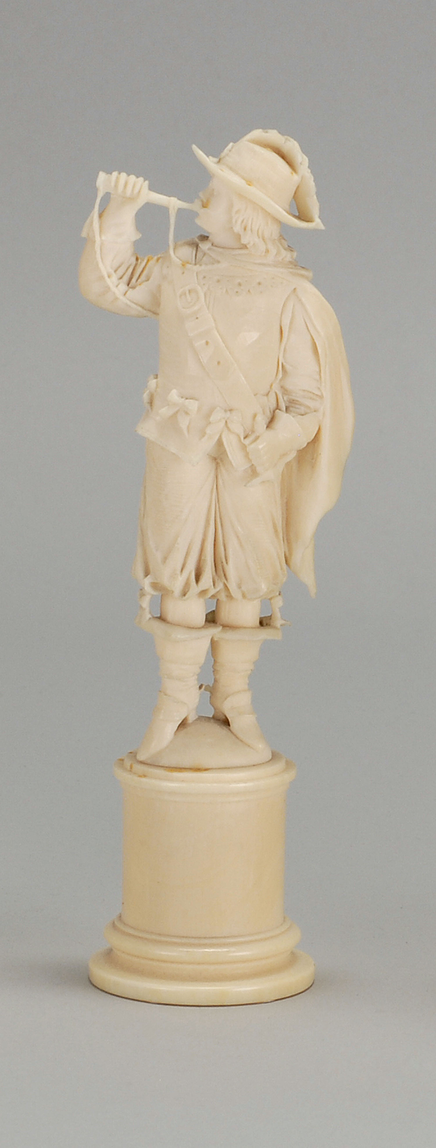 Appraisal: CONTINENTAL IVORY FIGURE Circa Depicting a cavalier blowing a trumpet