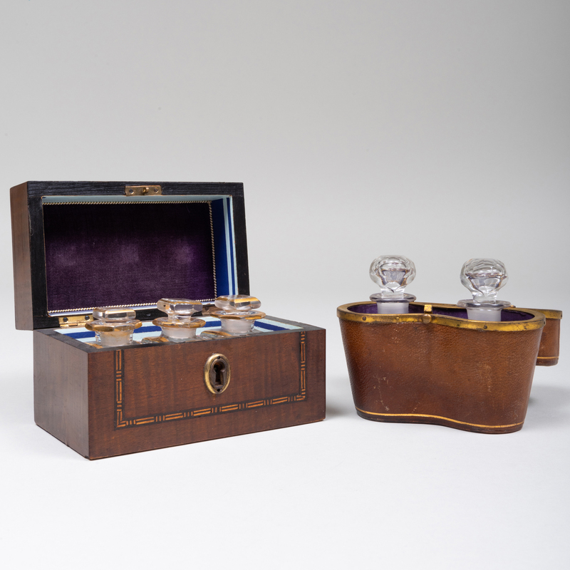 Appraisal: TWO SETS OF GILT-DECORATED GLASS SCENT BOTTLES IN CASES The