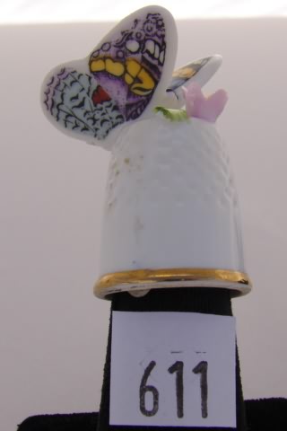 Appraisal: Enesco bone china thimble with butterfly top