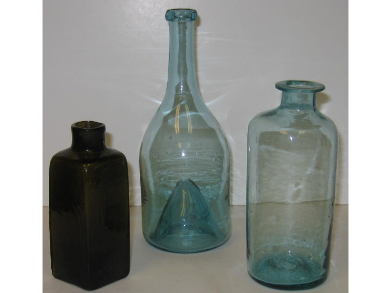 Appraisal: THREE BLOWN GLASS BOTTLES Aqua utility bottle aqua drinking bottle