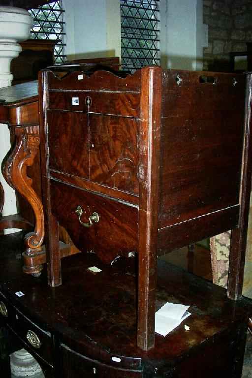 Appraisal: A Georgian mahogany tray top commode the front elevation enclosed