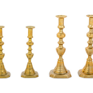 Appraisal: Four English Diamond Pattern Brass Candlesticks th Century Height of