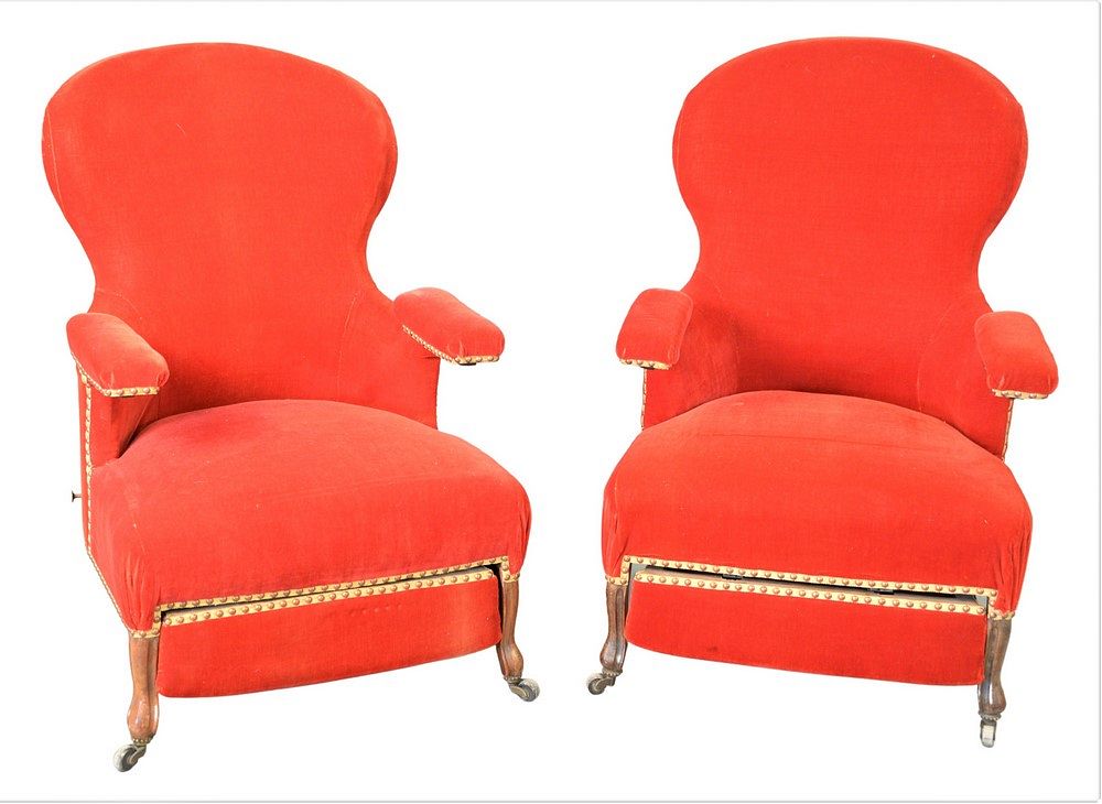 Appraisal: Pair of Victorian Upholstered Armchairs having pull out ottomans height