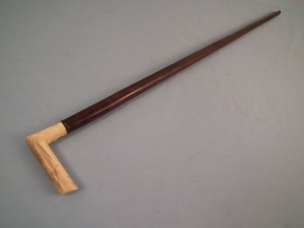 Appraisal: ANTIQUE BONE CANE th century wood shaft cane with right