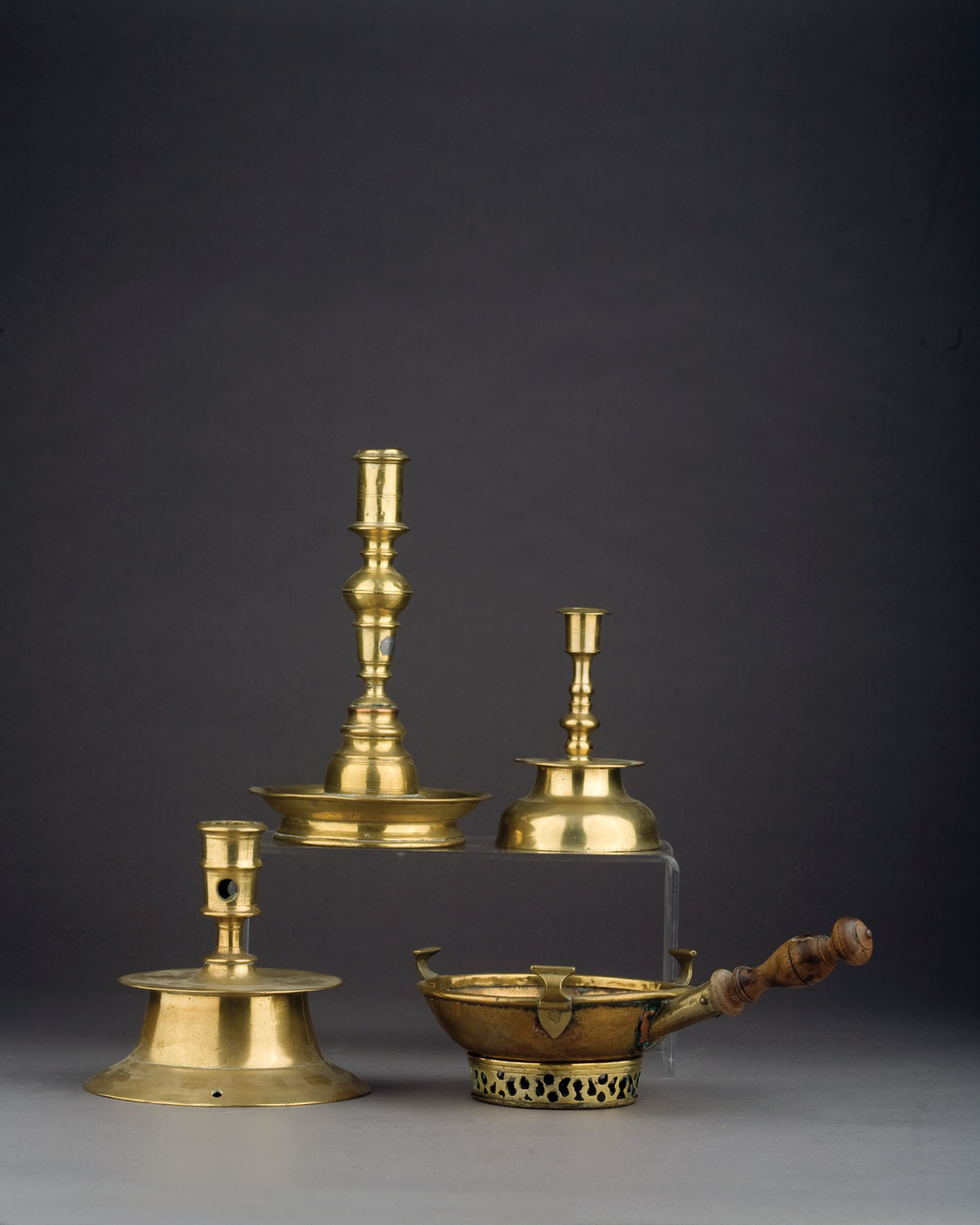 Appraisal: THREE EARLY BRASS CANDLESTICKS INCLUDING A BALUSTER FORM EXAMPLE WITH