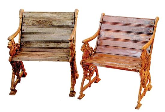 Appraisal: Pair cast-iron and wood garden chairs scrolling side supports unified