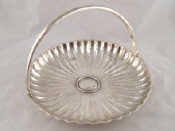 Appraisal: A Russian silver swing handled circular cake dish multi lobed