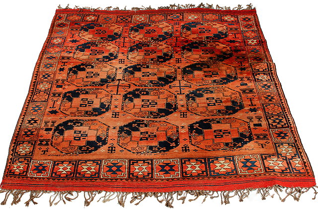 Appraisal: A MIDDLE EASTERN RED GROUND SMALL CARPET with three rows