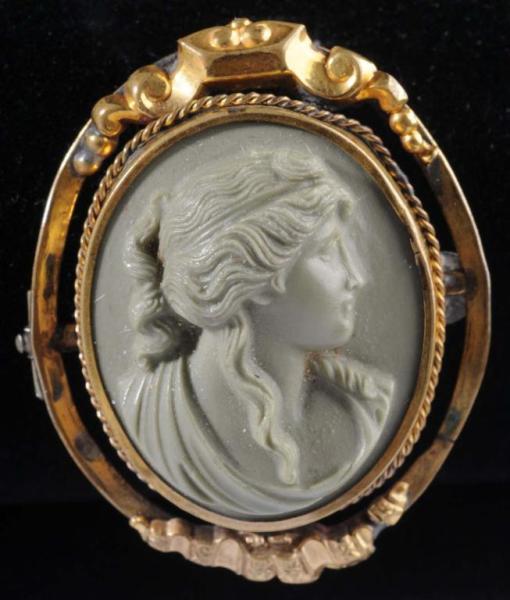 Appraisal: Cameo Pin Description Green molded cameo in gold-tone setting with