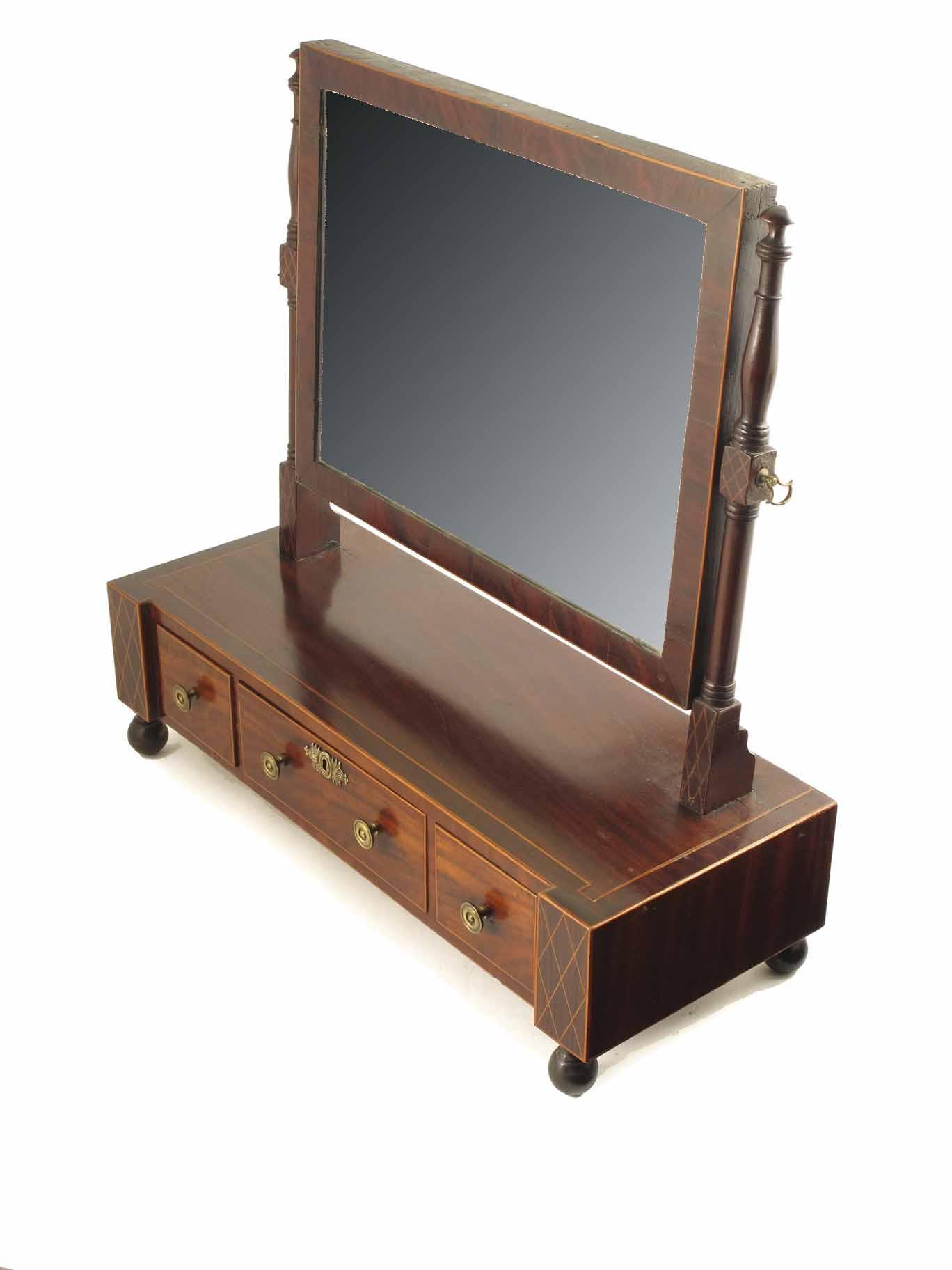 Appraisal: An early th century mahogany dressing table mirror