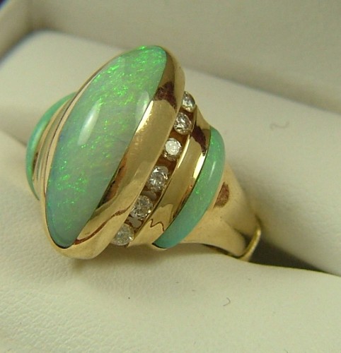 Appraisal: OPAL DIAMOND AND FOURTEEN KARAT GOLD RING set with three