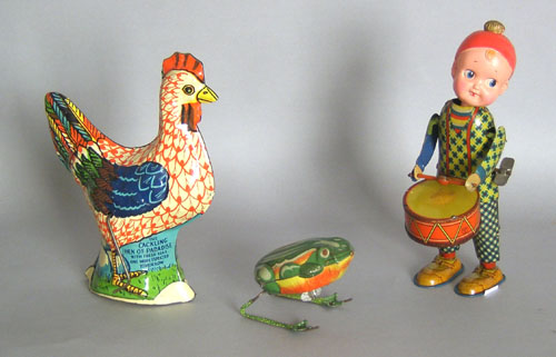 Appraisal: Three tin wind up toys th c tallest