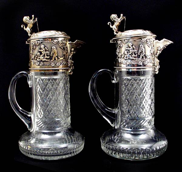 Appraisal: A pair of sterling mounted cut glass claret jugs height