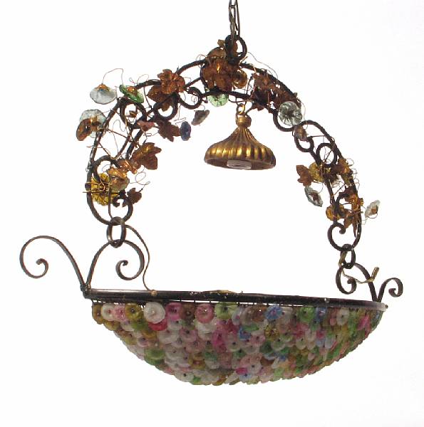 Appraisal: A pair of wrought iron and colored glass chandeliers height