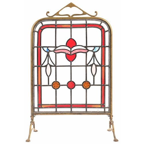 Appraisal: An Edwardian brass framed leaded glass firescreen cm h and