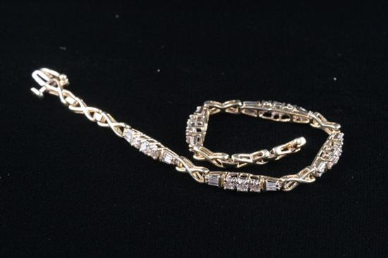 Appraisal: K YELLOW GOLD DIAMOND BRACELET Decorative -inch bracelet that throughout