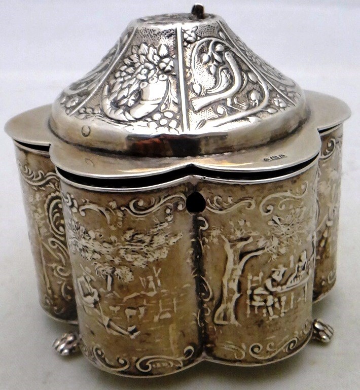 Appraisal: A Dutch silver hinge lidded tea caddy of lobed hexagonal