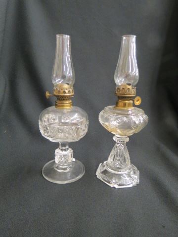 Appraisal: Miniature Oil Lamps clear pedestal bases with chimneys