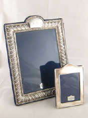 Appraisal: Two modern silver strut backed photo frames one with broad