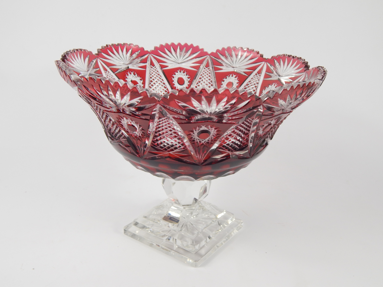 Appraisal: A German ruby flashed glass fruit bowl raised on a