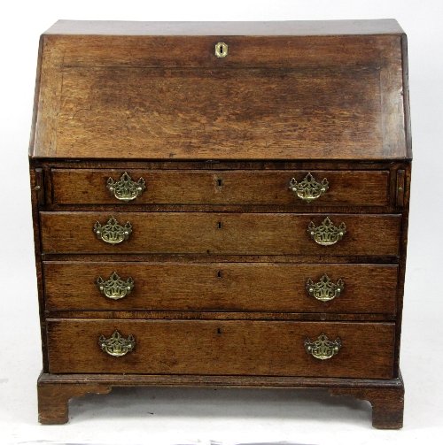 Appraisal: An early th Century oak bureau with fitted interior behind