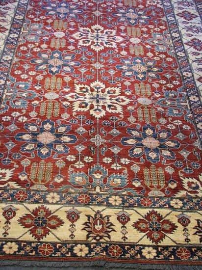 Appraisal: A KASAK STYLE RUST GROUND CARPET - with a dense