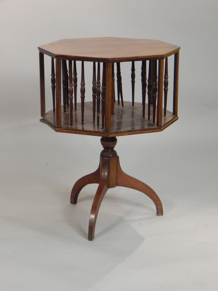 Appraisal: An Edwardian mahogany octagonal revolving bookcase with spindle turned supports