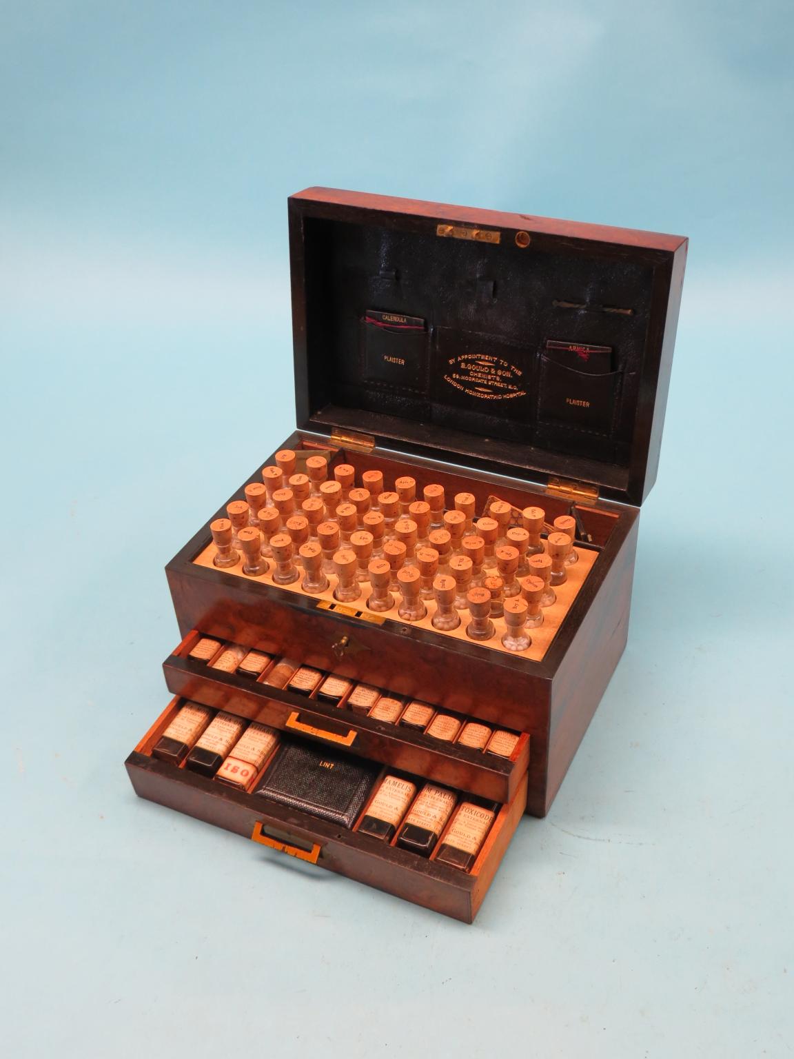 Appraisal: An early Victorian burr walnut chemist's dispensing case hinged cover