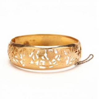 Appraisal: KT Bracelet with Egyptian Theme the tapered gold bracelet in