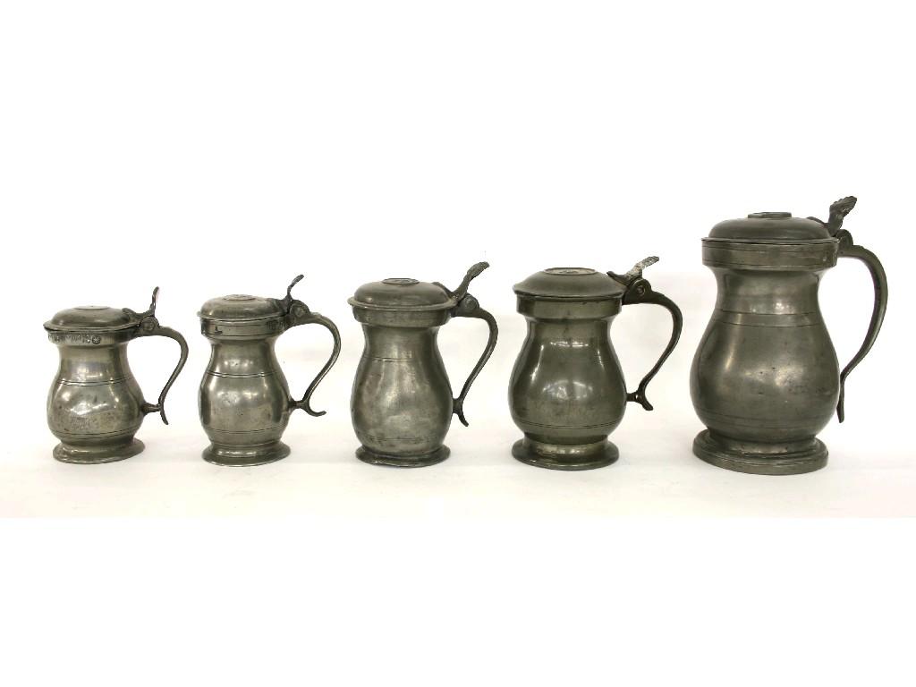 Appraisal: Graduated harlequin set of five lidded pewter baluster tankards with