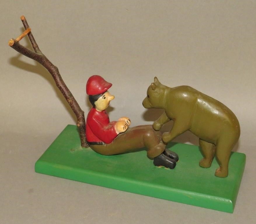 Appraisal: UNSIGNED FOLK ART CARVING OF HUNTER BEAR ATTRIca s comical