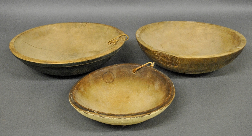 Appraisal: - Three th c wooden bowls largest with blue paint