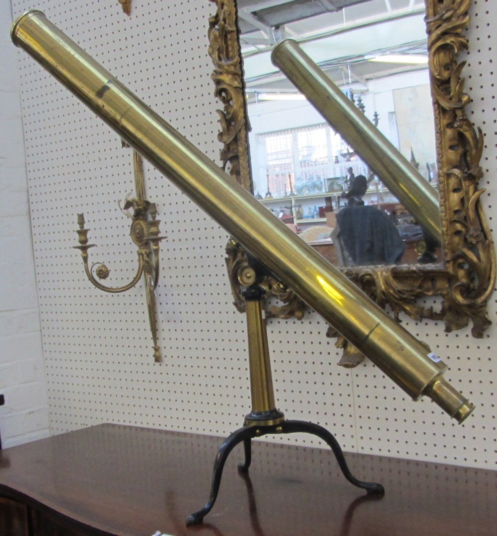 Appraisal: A th century lacquered brass two draw telescope on tripod