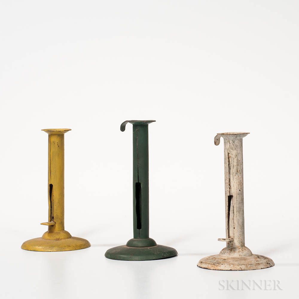 Appraisal: Three Painted Iron Hogscraper Candlesticks Three Painted Iron Hogscraper Candlesticks