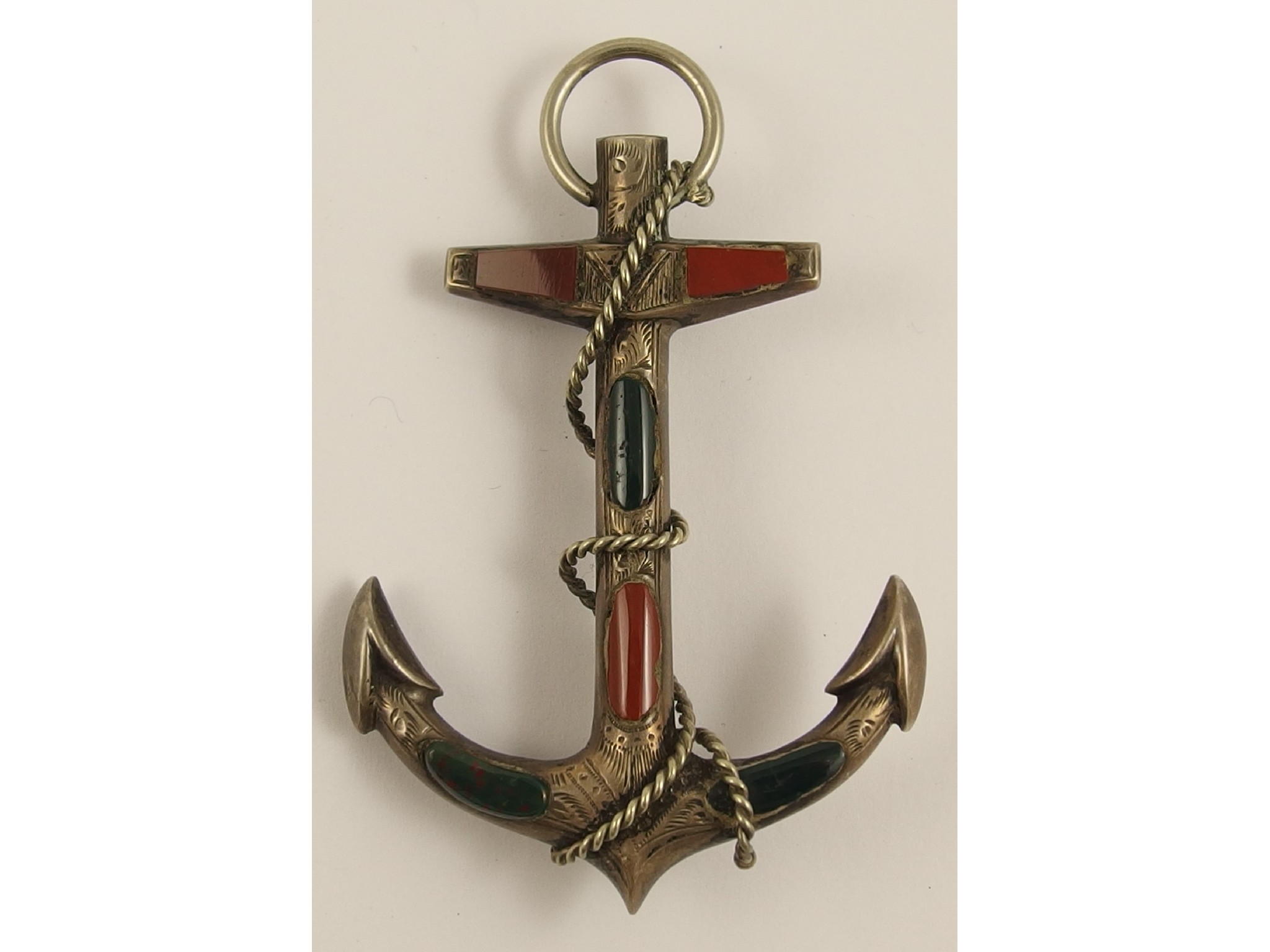 Appraisal: A Victorian white metal Scottish agate inlaid anchor brooch