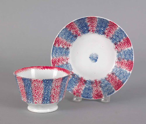 Appraisal: Blue and red rainbow spatter cup and saucer th c