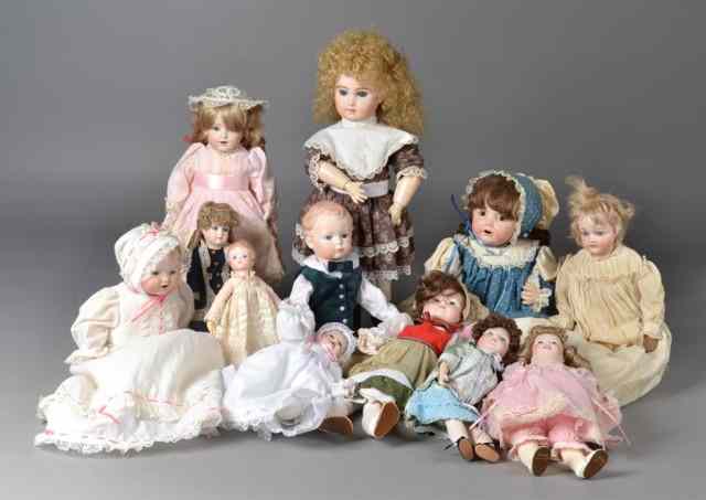 Appraisal: Grouping of Porcelain Dolls and ClothesTo include various dolls and