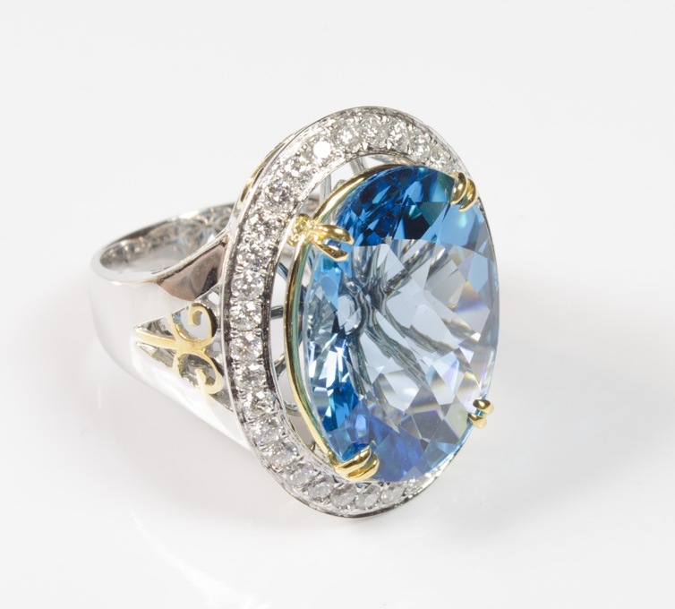 Appraisal: BLUE TOPAZ DIAMOND AND FOURTEEN KARAT GOLD RING The heavy