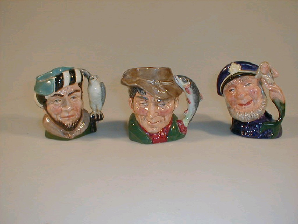 Appraisal: Three Royal Doulton small character figures The Falconer D The