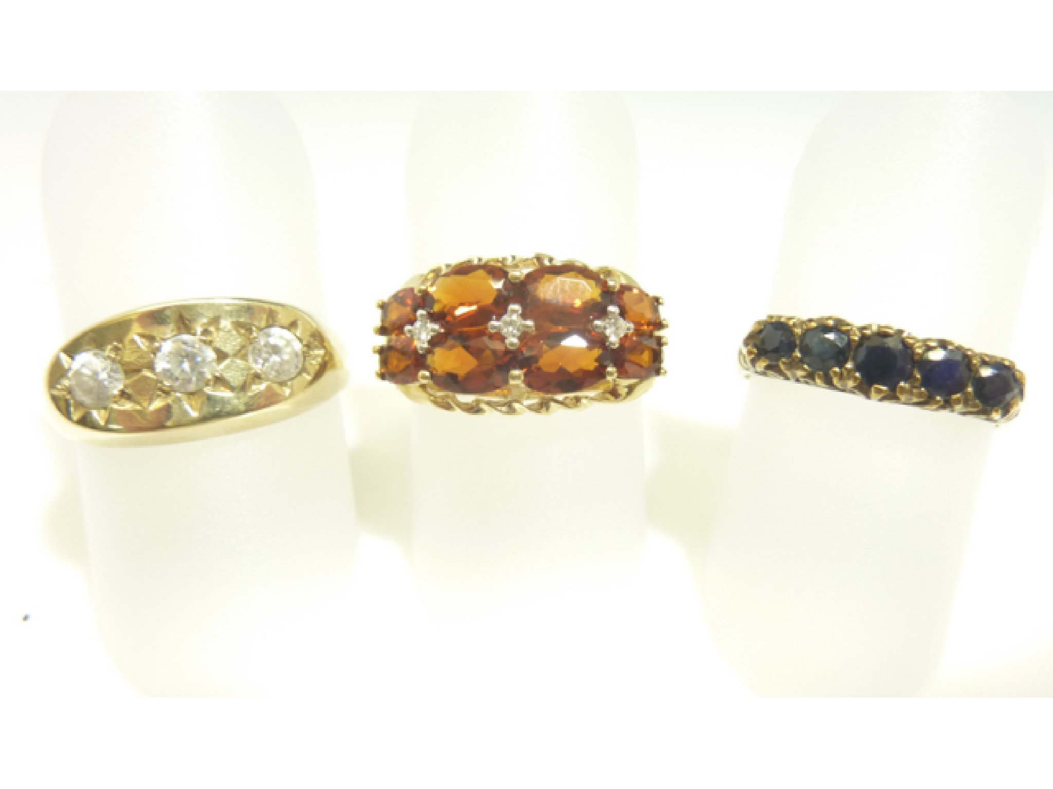 Appraisal: An Edwardian style ring set with five graduated blue stones