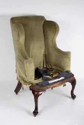 Appraisal: A George II walnut framed wing armchair in need of