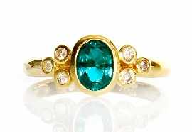 Appraisal: An ct gold green stone and six diamond ring size