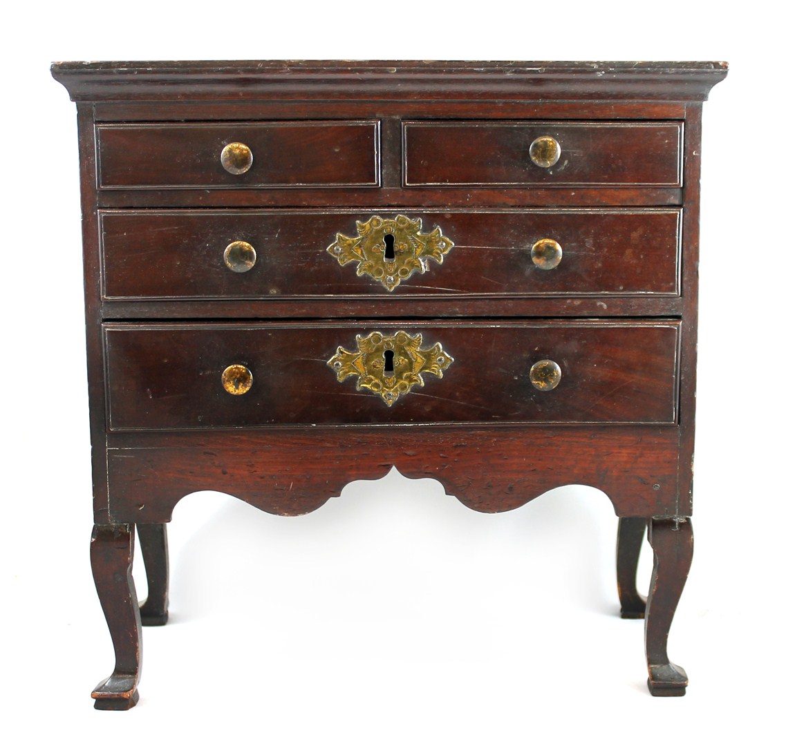 Appraisal: A miniature mahogany chest of two short and two long