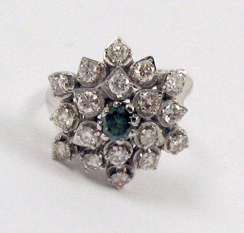 Appraisal: GREEN DIAMOND AND FOURTEEN KARAT GOLD RING centering a round-cut