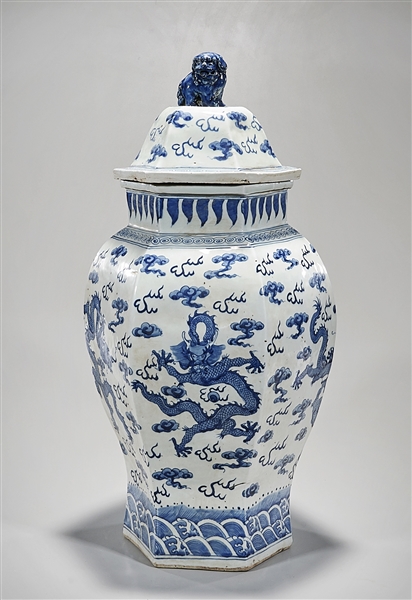 Appraisal: Tall Chinese blue and white porcelain covered vase depicting dragons