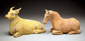 Appraisal: TWO TANG RECUMBENT ANIMALS Two unusually well modeled Chinese Tang